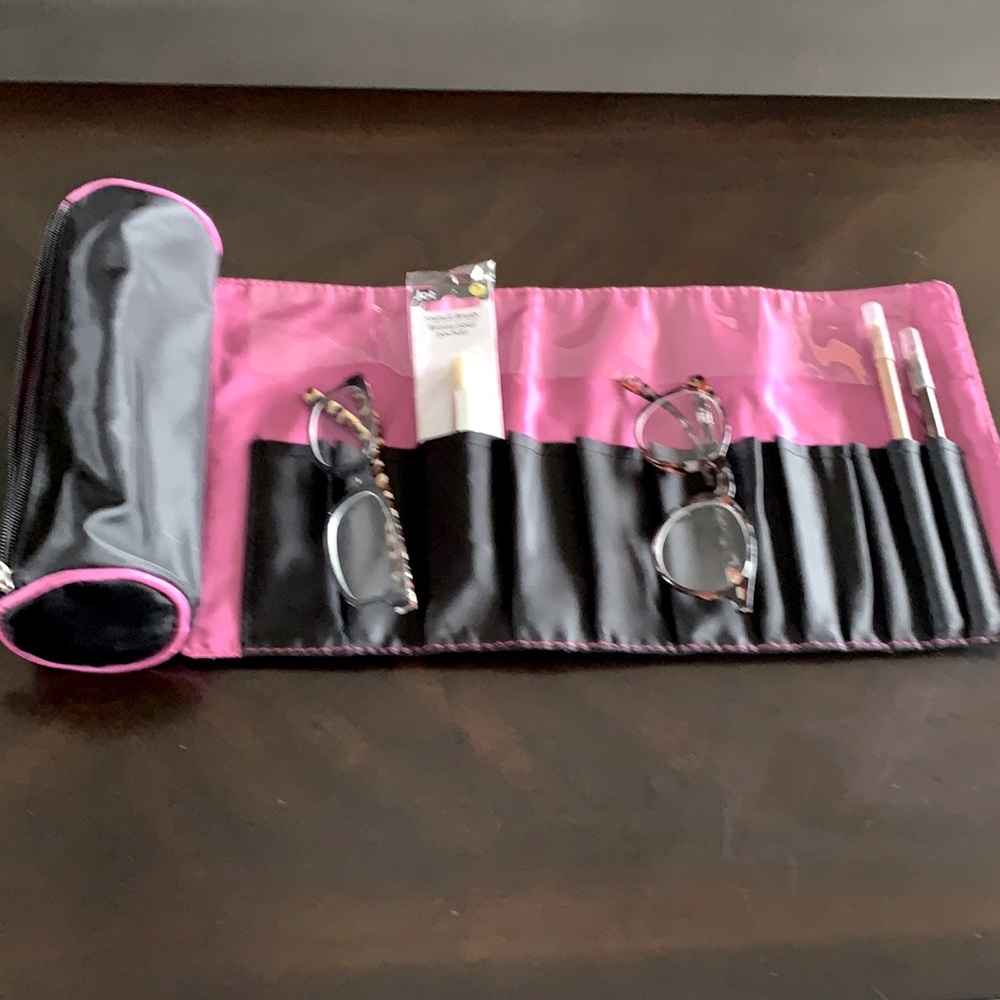 Black waterproof cosmetic travel pouch.